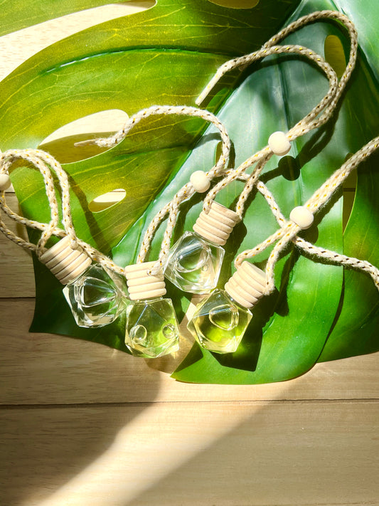 diamond shaped glass car accessories. include a breathable wood cap that allows for the scent to fill up the entire car. scented car diffusers you can hang in your car or any small space.